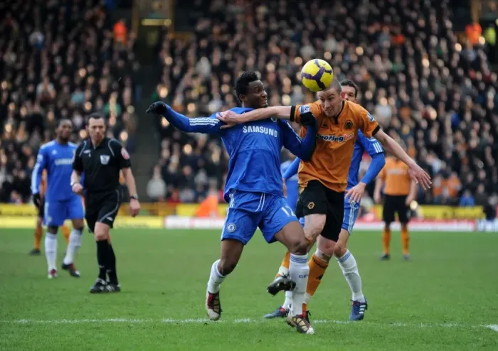 Framed Print : Clash of the Midfield Titans: Mikel vs. Jones in Wolverhampton Wanderers vs Chelsea Football Match Framed Print : Clash of the Midfield Titans: Mikel vs. Jones in Wolverhampton Wanderers vs Chelsea Football Match