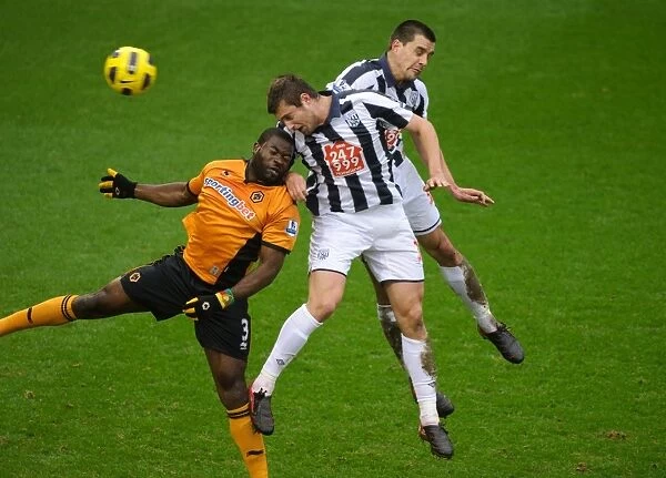 Clash of the Midlands: Elokobi, Tamas, and Scharner in Action - West Bromwich Albion vs. Wolverhampton Wanderers, Barclays Premier League