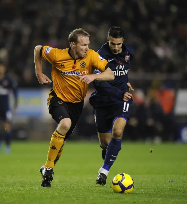 Framed Print : Clash of Titans: Jody Craddock vs Robin van Persie - Wolverhampton Wanderers vs Arsenal in the Barclays Premier League