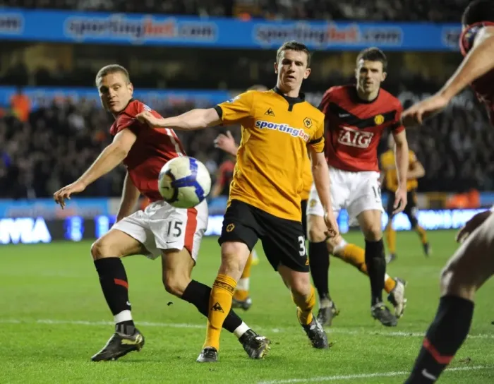 Framed Print : Clash of Titans: Nemanja Vidic vs. Kevin Foley - Wolves vs. Manchester United, Premier League (2010) Framed Print : Clash of Titans: Nemanja Vidic vs. Kevin Foley - Wolves vs. Manchester United, Premier League (2010)