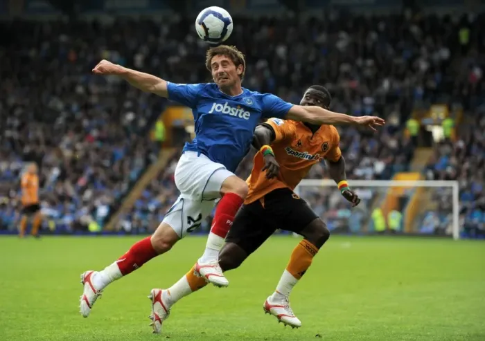 Framed Print : Clash of Titans: Smith vs. Elokobi - Portsmouth vs. Wolverhampton Wanderers, Premier League Showdown Framed Print : Clash of Titans: Smith vs. Elokobi - Portsmouth vs. Wolverhampton Wanderers, Premier League Showdown