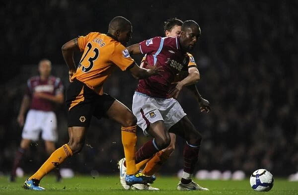 Determined Defenders: Zubar and Foley's Chase Down of Carlton Cole - Wolverhampton Wanderers vs. West Ham United