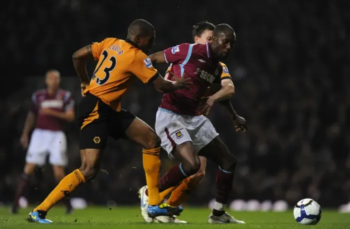 Framed Print : Determined Defenders: Zubar and Foley's Chase Down of Carlton Cole - Wolverhampton Wanderers vs. West Ham United Framed Print : Determined Defenders: Zubar and Foley's Chase Down of Carlton Cole - Wolverhampton Wanderers vs. West Ham United