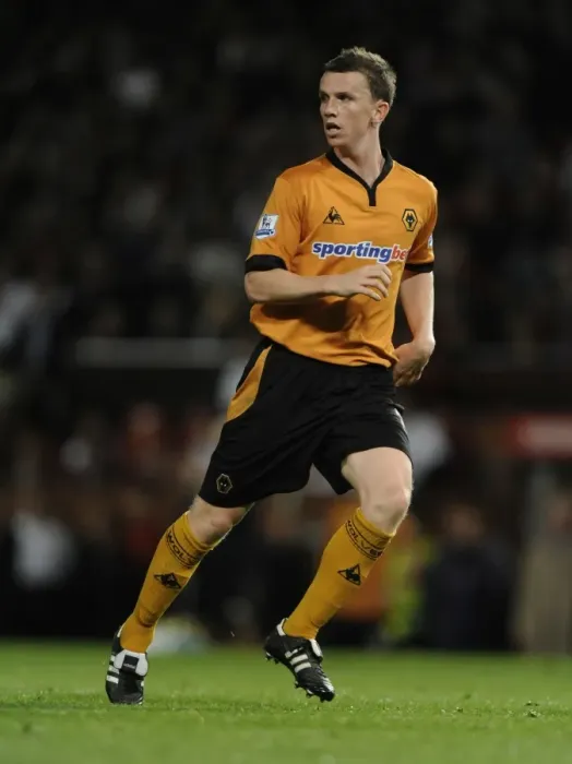 Framed Print : Determined Defiance: Kevin Foley's Challenge Against Manchester United in Carling Cup