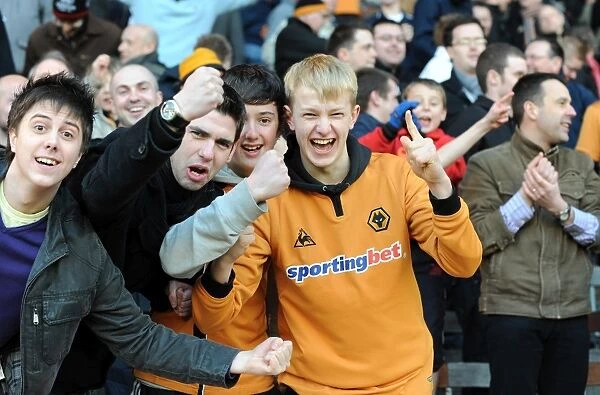 Euphoric Wolves Fans Celebrate Premier League Victory on the Pitch: Burnley vs. Wolverhampton Wanderers