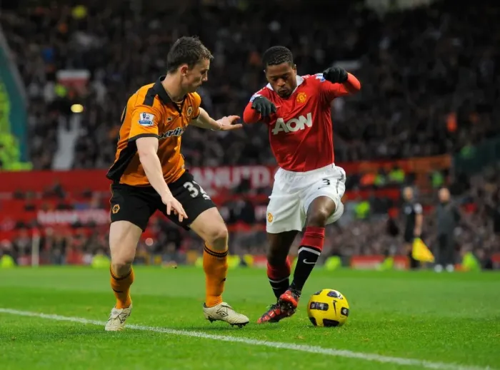 Framed Print : Evra vs. Foley: A Tense Encounter Between Manchester United and Wolverhampton Wanderers in the Premier League Framed Print : Evra vs. Foley: A Tense Encounter Between Manchester United and Wolverhampton Wanderers in the Premier League