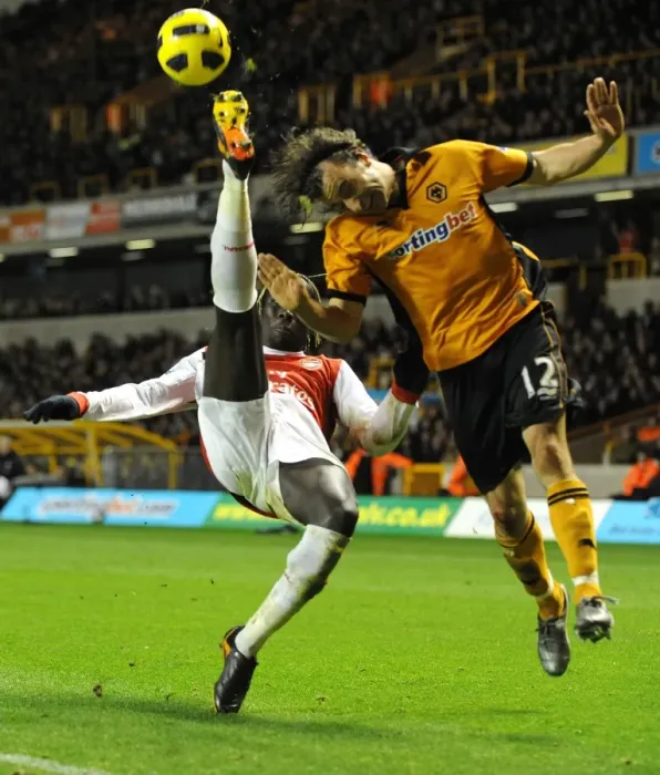 Framed Print : High Stakes Showdown: Wolverhampton Wanderers vs. Arsenal - Aerial Battle: Hunt vs. Sagna Framed Print : High Stakes Showdown: Wolverhampton Wanderers vs. Arsenal - Aerial Battle: Hunt vs. Sagna