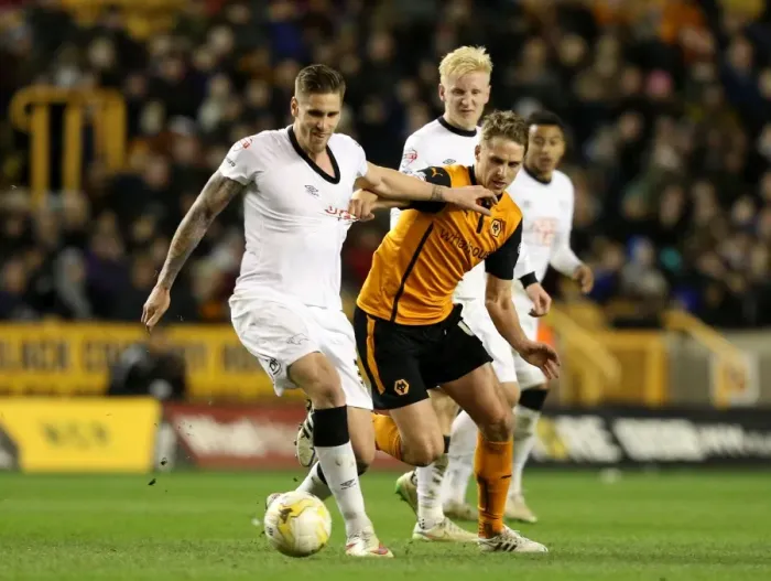 Framed Print : Intense Battle for Championship Supremacy: Wolves vs Derby County