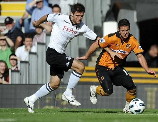 Intense Battle: Matt Jarvis vs Aaron Hughes - Fulham vs Wolverhampton Wanderers in the Barclays Premier League