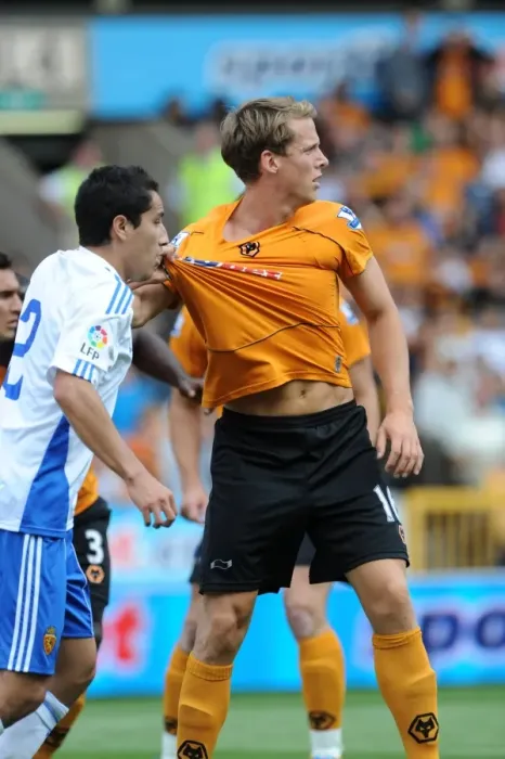 Framed Print : Intense Pre-Season Clash: Berra vs. Juarez - Wolves vs. Real Zaragoza: A Battle for Supremacy