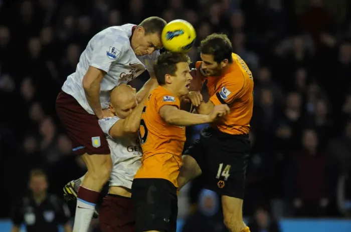 Framed Print : Intense Rivalry: Dunne vs. Collins & Berra - Wolverhampton Wanderers vs. Aston Villa, Premier League Battle Framed Print : Intense Rivalry: Dunne vs. Collins & Berra - Wolverhampton Wanderers vs. Aston Villa, Premier League Battle