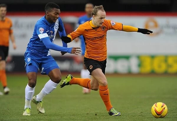 Intense Rivalry: Griffiths vs Nthle Battle in Wolverhampton Wanderers vs Peterborough United (Sky Bet League One)
