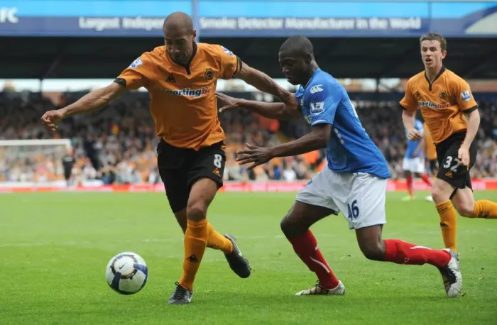 Framed Print : Intense Rivalry: Henry vs. Sowah Clash in Portsmouth vs. Wolverhampton Premier League Showdown