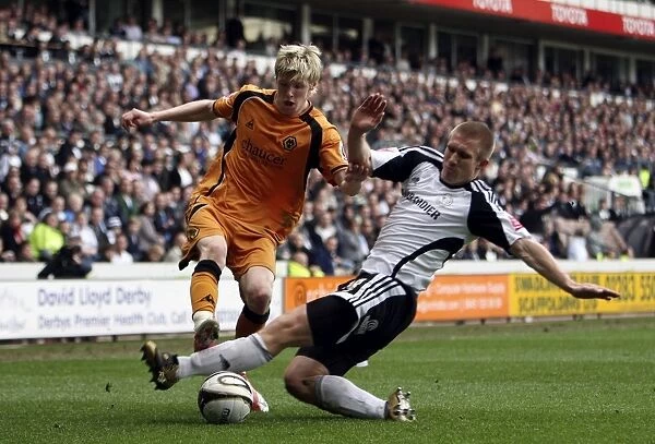 Intense Rivalry: Keogh vs. Albrechtsen Clash in Wolverhampton Wanderers vs Derby County Championship Match, 2009