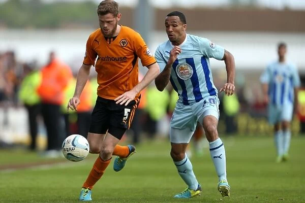 Intense Rivalry: Wilson vs. Stearman Battle for Ball in Wolverhampton Wanderers vs. Coventry City (Sky Bet League One)