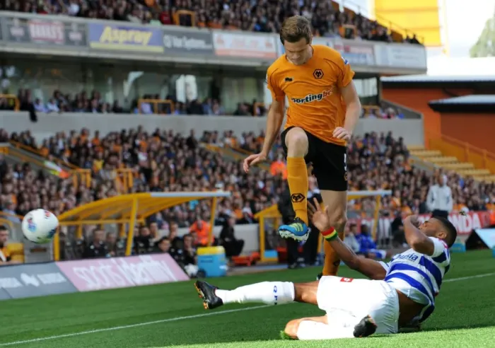 Framed Print : Leaping Over the Challenge: Stearman's Aerial Victory in Wolves vs. QPR (Premier League Soccer)