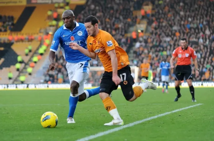 Framed Print : Matt Jarvis vs Emmerson Boyce: A Football Rivalry in the Barclays Premier League - Wolverhampton Wanderers vs Wigan Athletic