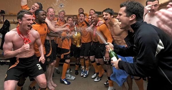Players of Wolverhampton Wanderers celebrate with the trophy after winning the Coca Cola Football League Championship