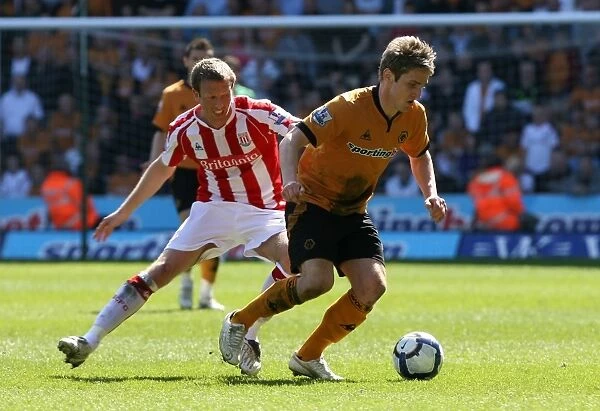 A Tense Clash: Collins vs. Doyle in the Barclays Premier League - Wolverhampton Wanderers vs. Stoke City (11-04-10)