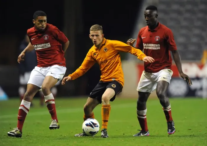 Framed Print : Tense Showdown: Holmes-Dennis vs. Sho-Silva in FA Youth Cup Clash at Molineux (Wolverhampton Wanderers U18 vs Charlton Athletic U18)