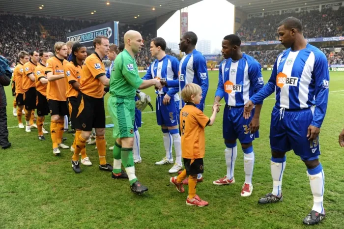 Framed Print : Thrilling Mascot Showdown: Wolverhampton Wanderers vs Wigan Athletic - Barclays Premier League Framed Print : Thrilling Mascot Showdown: Wolverhampton Wanderers vs Wigan Athletic - Barclays Premier League