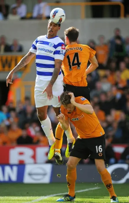 Framed Print : Three Titans Clash: A Tense Battle between Wolverhampton Wanderers Johnson, Bothroyd, and Berra in the Wolves vs. Queens Park Rangers Showdown Framed Print : Three Titans Clash: A Tense Battle between Wolverhampton Wanderers Johnson, Bothroyd, and Berra in the Wolves vs. Queens Park Rangers Showdown