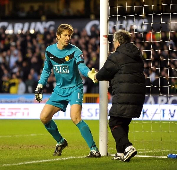 An Unusual Delivery: Edwin van der Sar Receives an Energy Biscuit During Wolverhampton Wanderers vs Manchester United (Barclays Premier League)