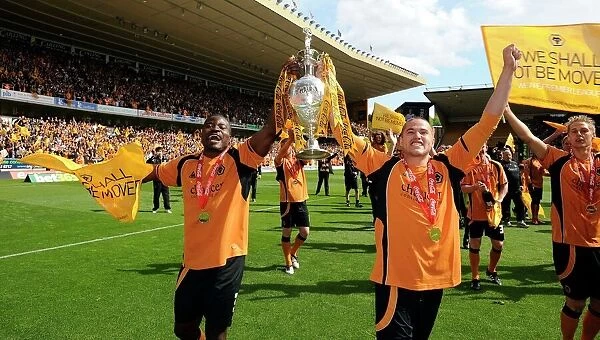 Wolverhampton Wanderers: George Elokobi and Michael Kightly Celebrate Championship Promotion with the Trophy