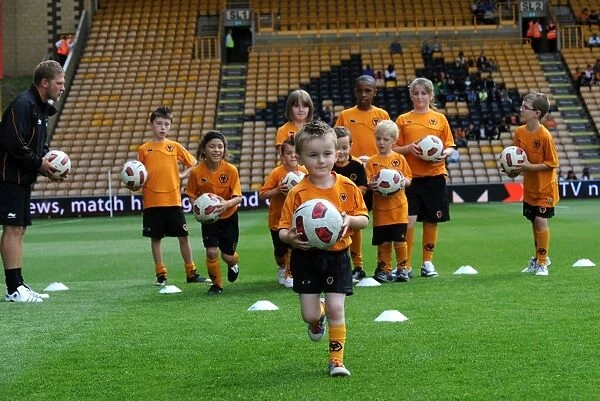 Wolverhampton Wanderers Matchday Mascots Training on the Pitch: Wolves vs Real Zaragoza