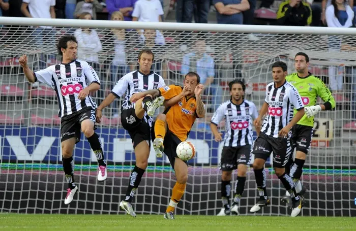Framed Print : Wolverhampton Wanderers Stephen Fletcher Outsmarts Charleroi Defenders in Pre-Season Clash Framed Print : Wolverhampton Wanderers Stephen Fletcher Outsmarts Charleroi Defenders in Pre-Season Clash
