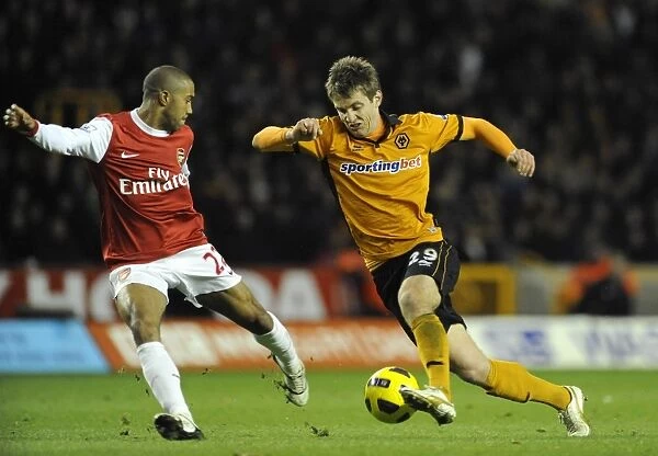 Wolverhampton Wanderers vs Arsenal: Intense Encounter between Kevin Doyle and Gael Clichy in the Premier League