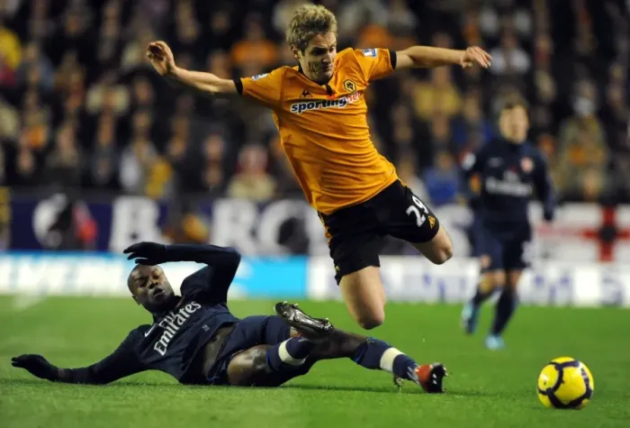 Framed Print : Wolverhampton Wanderers vs Arsenal: A Premier League Battle - Doyle vs Gallas