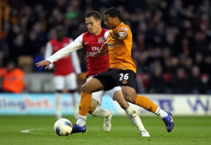 Framed Print : Wolverhampton Wanderers vs. Arsenal: A Premier League Showdown - Davis vs. Ramsey
