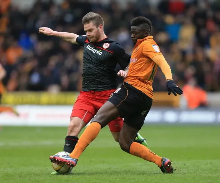 Framed Print : Wolverhampton Wanderers vs. Cardiff City: A Championship Showdown - Midfield Battle between Sako and Gunnarsson Framed Print : Wolverhampton Wanderers vs. Cardiff City: A Championship Showdown - Midfield Battle between Sako and Gunnarsson