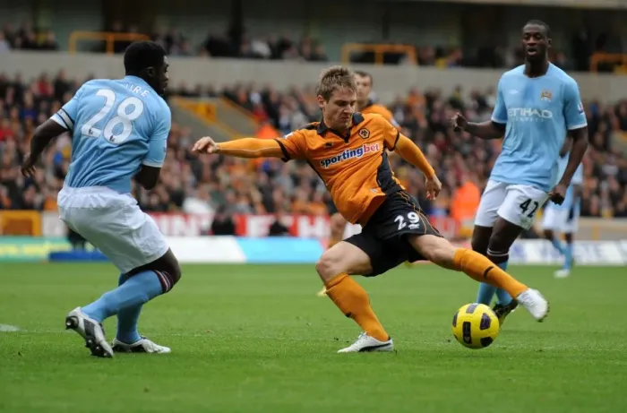 Framed Print : Wolverhampton Wanderers vs Manchester City: A Battle Between Kevin Doyle and Kolo Toure in the Premier League Framed Print : Wolverhampton Wanderers vs Manchester City: A Battle Between Kevin Doyle and Kolo Toure in the Premier League