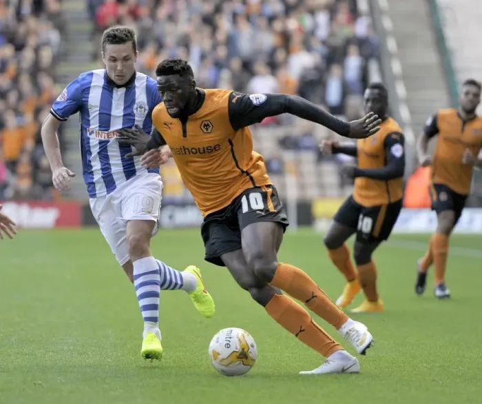 Framed Print : Wolverhampton Wanderers vs Wigan Athletic: A Championship Showdown - Sako vs Cowie's Intense Battle for Possession Framed Print : Wolverhampton Wanderers vs Wigan Athletic: A Championship Showdown - Sako vs Cowie's Intense Battle for Possession