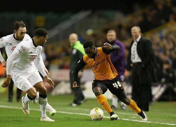 Wolves vs Derby County: Intense Battle Between Nouha Dicko and Cyrus Christie at Molineux Stadium (Sky Bet Championship)