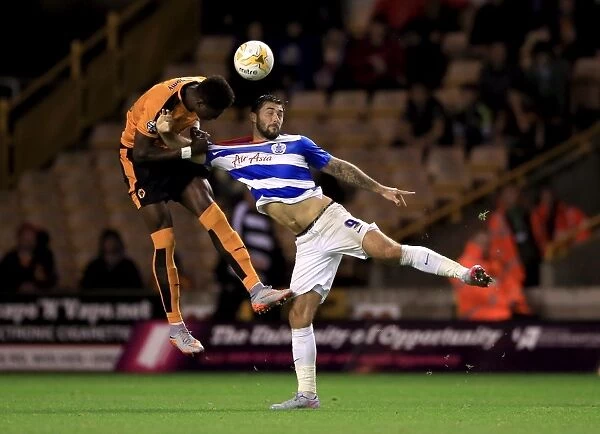 Wolves vs. Queens Park Rangers: Intense Battle for the Ball between Charlie Austin and Kortney Hause