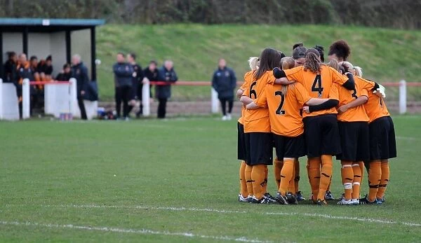 Wolves Women Unite: A Powerful Huddle Before Kick-Off Against Leafield Athletic