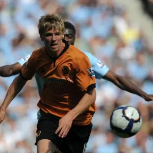 Andy Keogh at Manchester City: A Determined Moment from Wolves Premier League Clash (22/8/09)
