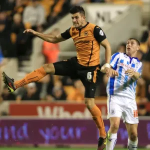 Batth's Dominance: Wolves vs Huddersfield Town - Championship Showdown at Molineux (Danny Batth Outjumps Grant Holt) Batth's Dominance: Wolves vs Huddersfield Town - Championship Showdown at Molineux (Danny Batth Outjumps Grant Holt)