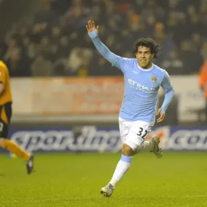 Carlos Tevez's Goal Celebration: Manchester City Takes the Lead over Wolverhampton Wanderers in Premier League Soccer Match Carlos Tevez's Goal Celebration: Manchester City Takes the Lead over Wolverhampton Wanderers in Premier League Soccer Match