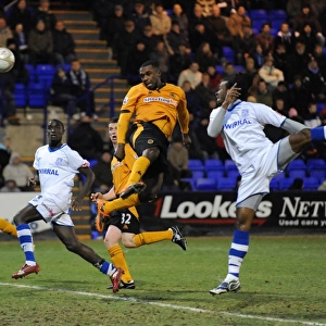 Charging Forward: Sylvan Ebanks-Blake's Determined Advance Towards the Goal in FA Cup Round Three (Tranmere Rovers vs. Wolverhampton Wanderers)