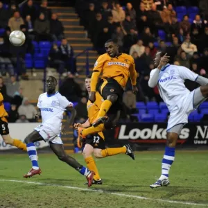 Charging Forward: Sylvan Ebanks-Blake's Determined Advance Towards the Goal in FA Cup Round Three (Tranmere Rovers vs. Wolverhampton Wanderers)