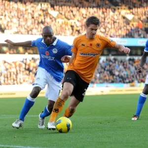 Clash between Kevin Doyle and Emmerson Boyce: A Battle in the Wolverhampton Wanderers vs Wigan Athletic Barclays Premier League Match