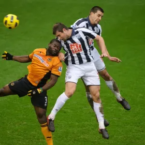 Clash of the Midlands: Elokobi, Tamas, and Scharner in Action - West Bromwich Albion vs. Wolverhampton Wanderers, Barclays Premier League Clash of the Midlands: Elokobi, Tamas, and Scharner in Action - West Bromwich Albion vs. Wolverhampton Wanderers, Barclays Premier League