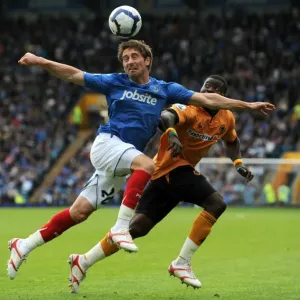 Clash of Titans: Smith vs. Elokobi - Portsmouth vs. Wolverhampton Wanderers, Premier League Showdown Clash of Titans: Smith vs. Elokobi - Portsmouth vs. Wolverhampton Wanderers, Premier League Showdown