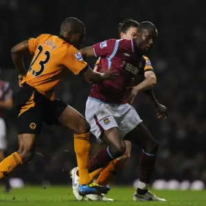 Determined Defenders: Zubar and Foley's Chase Down of Carlton Cole - Wolverhampton Wanderers vs. West Ham United Determined Defenders: Zubar and Foley's Chase Down of Carlton Cole - Wolverhampton Wanderers vs. West Ham United