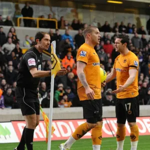 Disputed Quick Corner: Wolverhampton Wanderers Kightly and Jarvis Argue with Assistant Referee