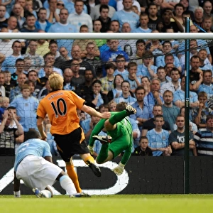 Dramatic Volley at City of Manchester Stadium: Andrew Keogh's Post-Hit Missile for Wolverhampton Wanderers vs. Manchester City, Premier League (August 22, 2009)